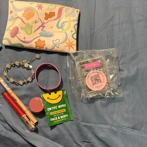 Colorful Patterned Pouch with various items, soap, makeup jewelry